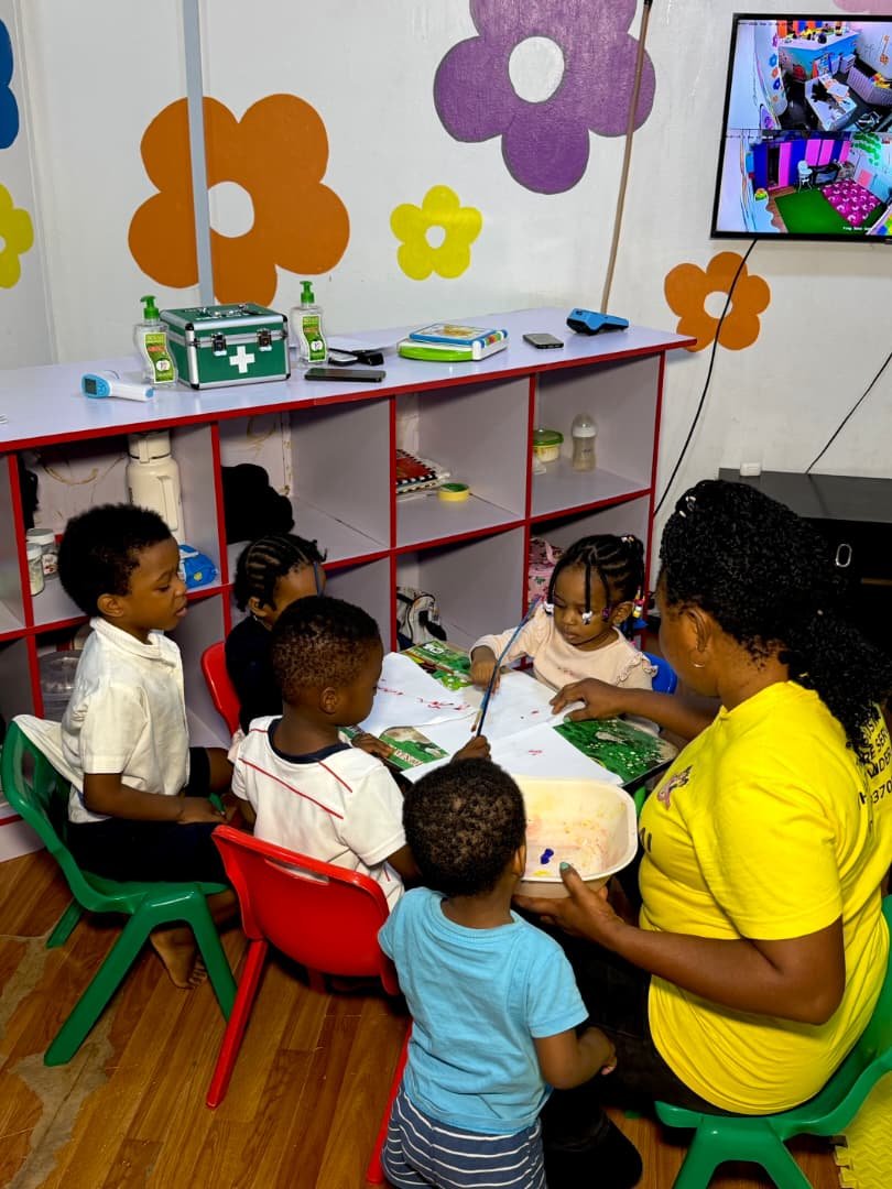 Caring teacher with children at Jeleosinmi